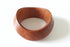 Wooden ring on a marble surface