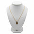 Gold necklace on a marble surface