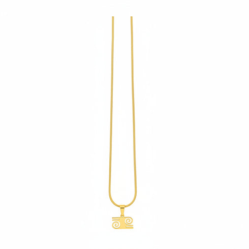 Gold necklace with a clasp on a marble surface