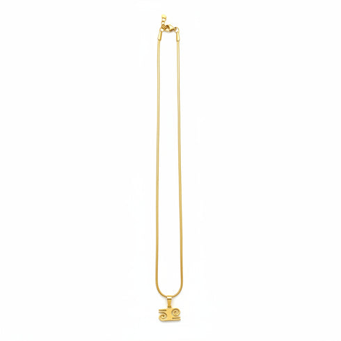 Gold necklace on a marble surface