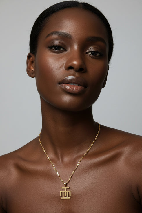 Gold necklace on a marble surface