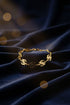 Gold chain bracelet on a marble surface