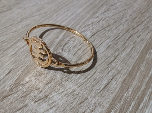 Gold ring on a wooden surface