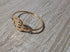 Gold ring on a wooden surface