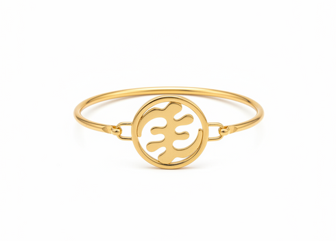 Gold bracelet with a circular design on a white background