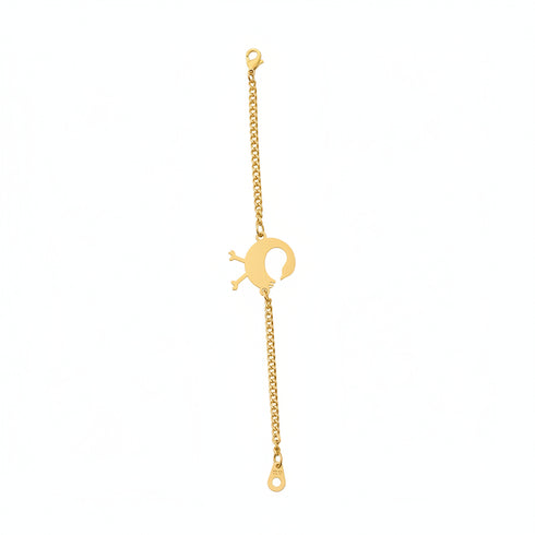 Gold bracelet with a unique clasp on a marble surface