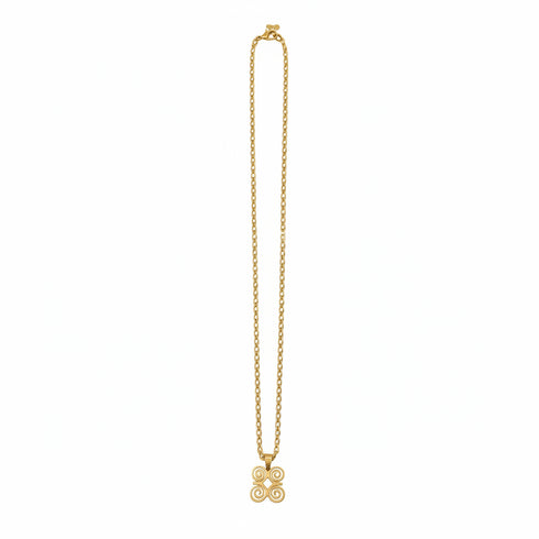 Gold necklace on a marble surface