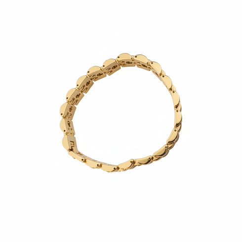 Gold bracelet on a marble surface