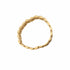 Gold bracelet on a marble surface