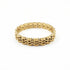 Gold bracelet on a marble surface