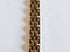 Gold bracelet on a marble surface