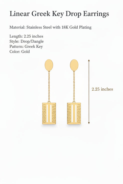 Gold earrings on a marble surface