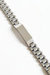 Silver watch bracelet on a marble surface