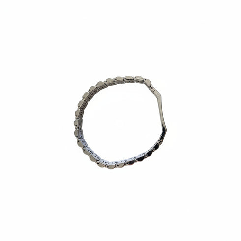 Silver bracelet on a marble surface