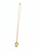 Gold necklace with a heart-shaped pendant on a white background