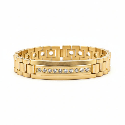 Gold ring with diamond accents on a marble surface
