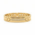 Gold ring with diamond accents on a marble surface