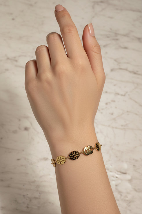 Decorative gold bracelet on a marble surface
