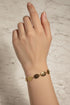 Decorative gold bracelet on a marble surface