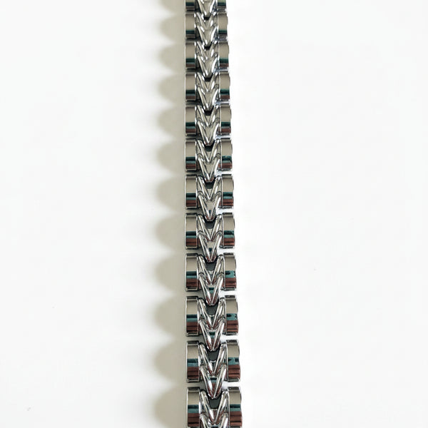 Silver chain bracelet on a white background