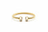 Gold bracelet on a marble surface