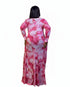 A woman viewed from the back wearing a long-sleeve maxi dress with a pink and white marble pattern, set against a plain white background.