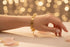 Gold bracelet on a marble surface