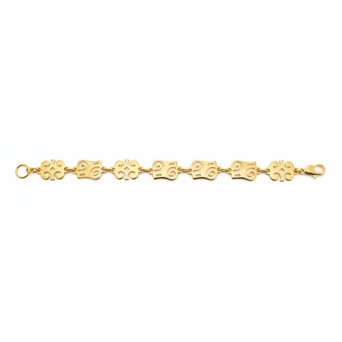 Gold bracelet with floral links on a white background