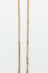 Gold chain on a marble surface