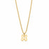 Gold necklace with a clover-shaped pendant on a marble surface