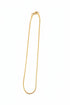 Gold hairpin on a marble surface