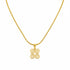 Gold hairpin with decorative end on a marble surface