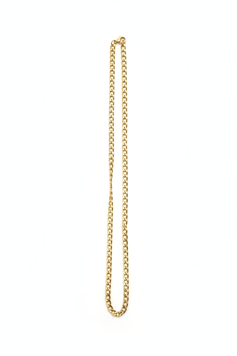 Gold chain on a marble surface