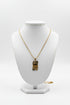 Necklace with a decorative clasp on a marble surface