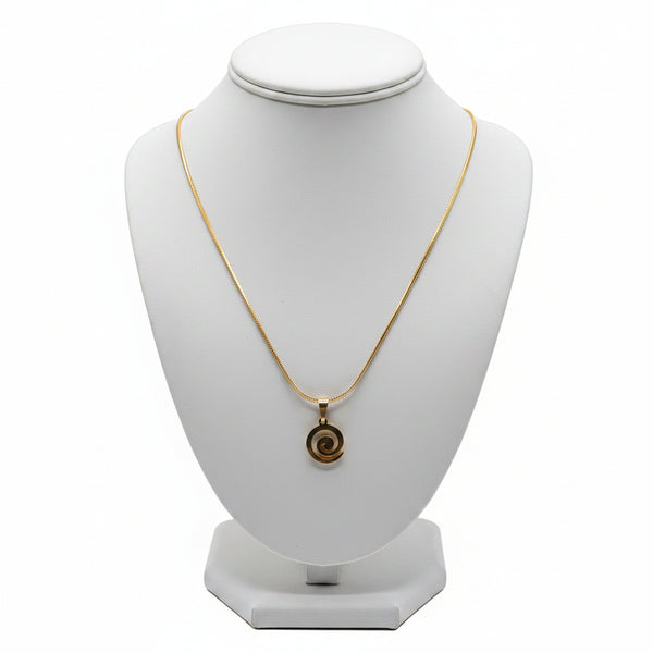 Gold necklace on a marble surface