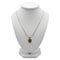 Gold necklace on a marble surface