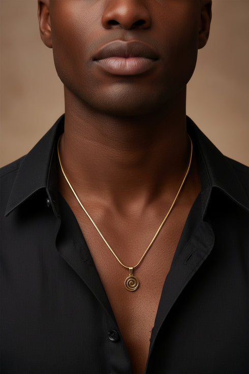Gold necklace on a marble surface