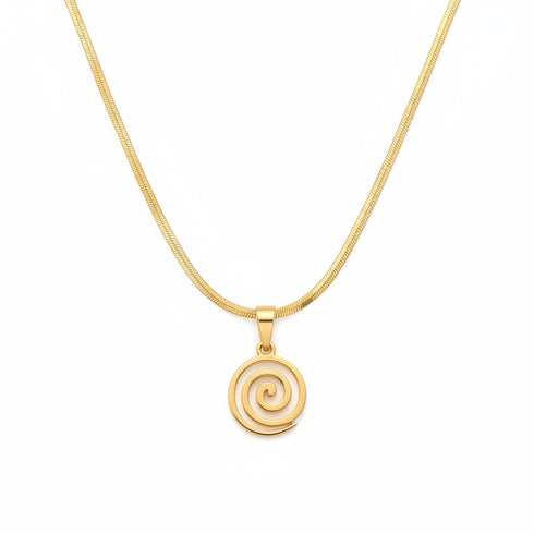 Gold necklace with a spiral design on a marble surface