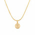 Gold necklace with a spiral design on a marble surface