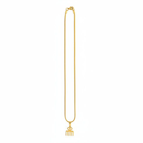 Gold necklace with a decorative clasp on a marble surface