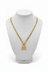 Gold chain necklace with a unique pendant on a marble surface