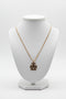 Gold necklace on a marble surface
