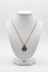 Gold necklace on a marble surface