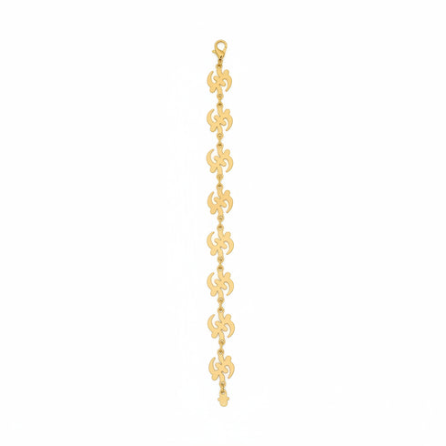 Gold chain bracelet on a marble surface
