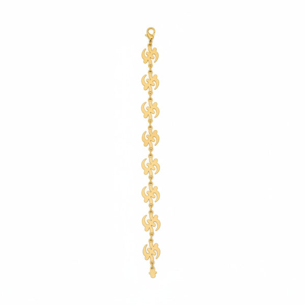 Gold chain bracelet on a marble surface