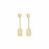 Gold earrings on a marble surface
