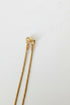 Gold hairpin on a marble surface