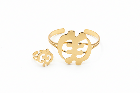 Two gold rings with unique designs on a white background