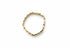 Gold bracelet on a marble surface
