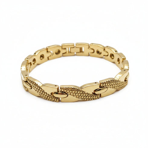 Gold bracelet on a marble surface